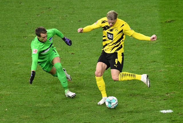 Dortmund’s Norwegian forward Erling Braut Haaland (right) scores past Hertha Berlin’s German goalkeeper Alexander Schwolow during their German first division Bundesliga match in Berlin on Saturday (AFP photo by Annegret Hilse)