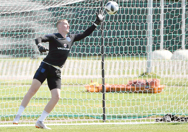 England’s goalkeeper Jordan Pickford tries to stop a ball during a World Cup training session in Repino, Russia, on Saturday  (AFP photo by Paul Ellis)