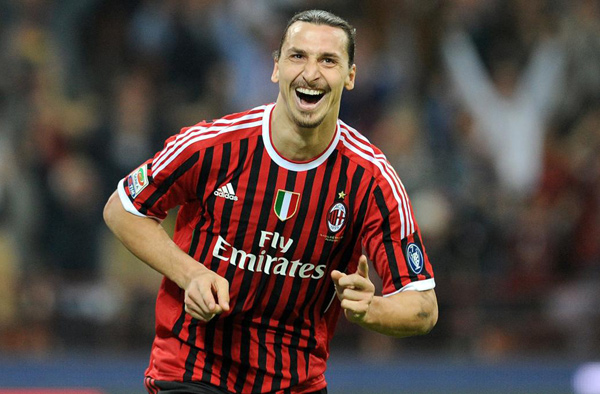 AC Milan’s Swedish forward Zlatan Ibrahimovic kicks and scores a penalty during the UEFA Champions League round of 16 first leg match against Arsenal in Milan on February 15, 2012  (AFP photo by Giuseppe Cacace)