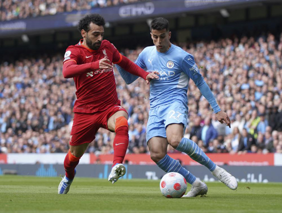 Manchester City’s João Cancelo (right) and Liverpool’s Mohamed Salah (AFP photo)