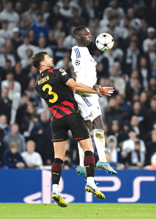 Manchester City’s Ruben Dias (left) and FC Copenhagen’s Mohammed Daramy vie for the ball during their UEFA Champions League Group G match in Copenhagen, Denmark, on Tuesday  (AFP photo by Jonathan Nackstrand)
