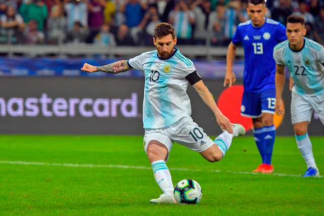 Argentina’s Lionel Messi takes a penalty awarded by the VAR against Paraguay during their Copa America football tournament group match in Belo Horizonte, Brazil, on Wednesday (AFP photo by Luis Acosta)