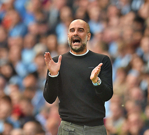 Manchester City’s Spanish manager Pep Guardiola reacts during the English Premier League football match against Tottenham Hotspur in Manchester, England, on Saturday  (AFP photo by Oli Scarff)