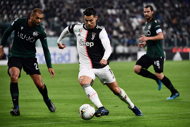 Juventus’ Portuguese forward Cristiano Ronaldo challenges Bologna’s Brazilian defender Danilo (left) during their Italian Serie A match in Turin on Saturday  (AFP photo by Marco Bertorello)