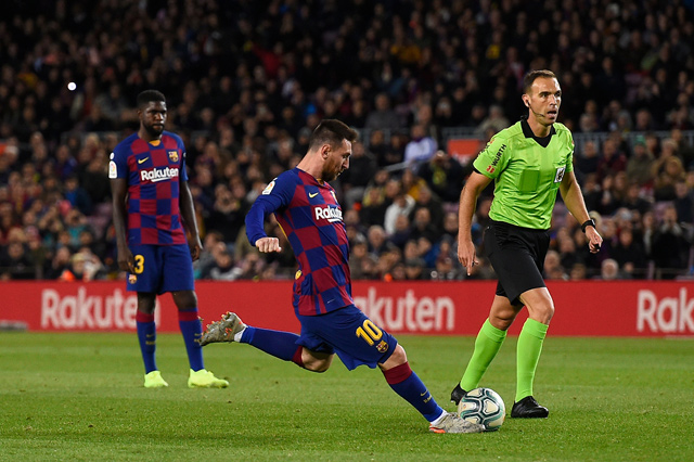 Barcelona’s Argentine forward Lionel Messi (centre) scores during the Spanish league football match against Celta de Vigo in Barcelona on Saturday (AFP photo by Josep Lago)