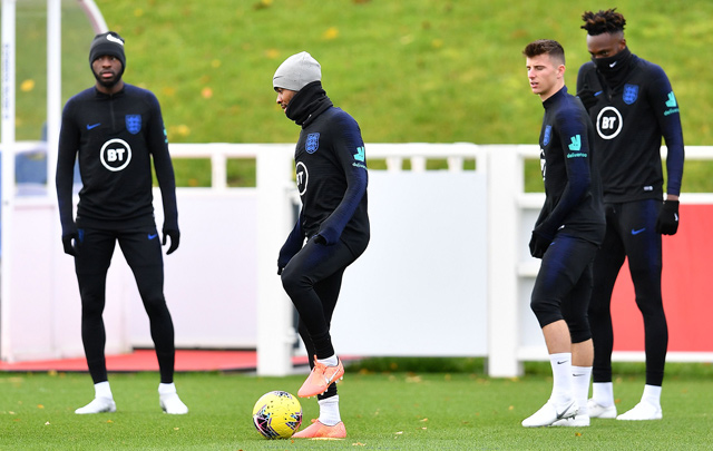 England’s midfielder Raheem Sterling (2nd left), England’s midfielder Mason Mount (2nd right) and England’s striker Tammy Abraham (right) attend an England team training session in Burton-on-Trent, England, on Tuesday  (AFP photo by Paul Ellis)