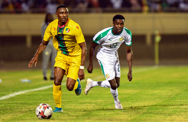 Moussa Wague from Senegal (right) vies for the ball with Anzouana Yhoan from Congo at the Lat-Dior Stadium in Thies, Senegal, on Wednesday during a qualifying game ahead of the 2021 Africa Cup of Nations (AFP photo by Seyllou)