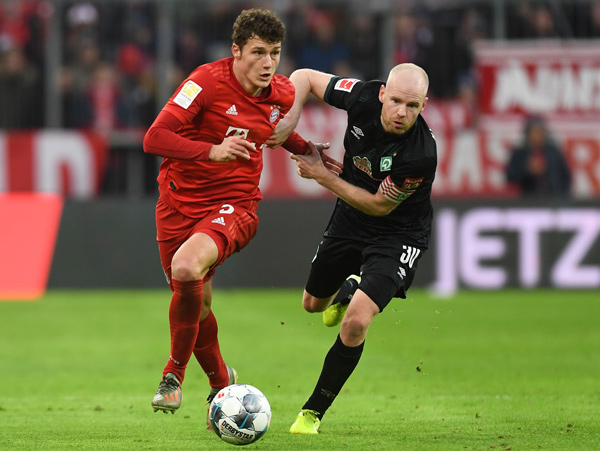 Bayern Munich’s French defender Benjamin Pavard (left) and Bremen’s Dutch midfielder Davy Klaassen vie for the ball during their German first division Bundesliga football match in Munich on Saturday (AFP photo by Christof Stache)