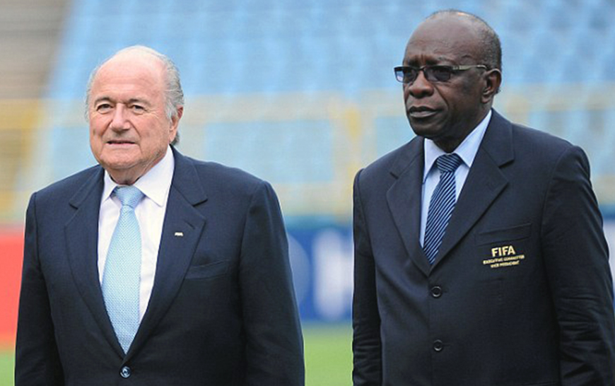 File photo of FIFA President Sepp Blatter standing alongside former CONCACAF president Jack Warner (right) (Photo courtesy of wordpress.com)