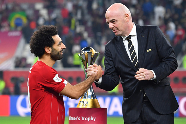 FIFA President Gianni Infantino greets Liverpool’s Egyptian midfielder Mohamed Salah (left) following the 2019 FIFA Club World Cup Final football match against Brazil’s Flamengo in Doha, Qatar, on Saturday (AFP photo by Giuseppe Cacace)