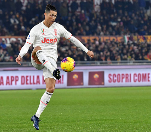 Juventus’ Portuguese forward Cristiano Ronaldo controls the ball against AS Roma during their Italian Serie A football match in Rome on Sunday (AFP photo by Tiziana Fabi)
