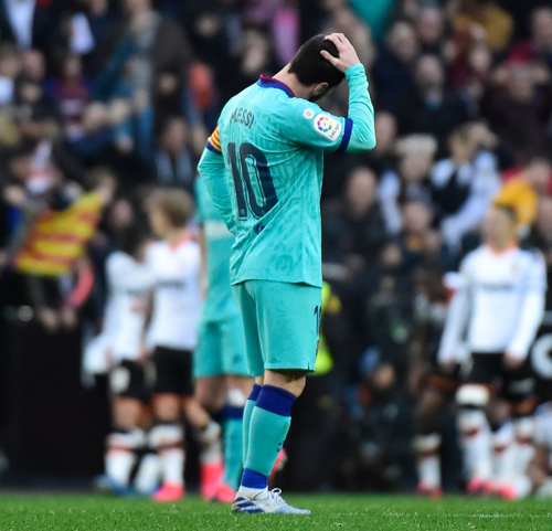 Barcelona’s Argentine forward Lionel Messi reacts against Valencia during their Spanish league football match in Valencia on Saturday (AFP photo by Jose Jordan)