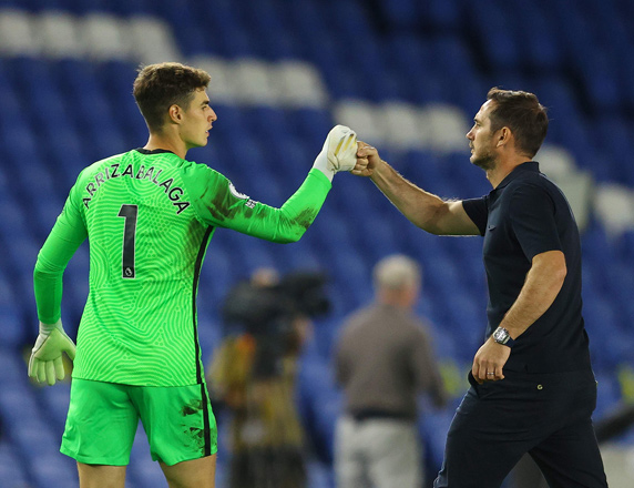 Chelsea’s head coach Frank Lampard (right) fist bumps his goalkeeper Kepa Arrizabalaga after their English Premier League match against Brighton and Hove Albion on Monday  (AFP photo by Richard Heathcote)