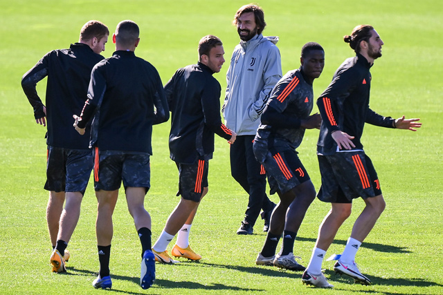 Juventus Italian coach Andrea Pirlo (3rd right) attends the players’ training session on the eve of the UEFA Champions League football group G match against Barcelona on Tuesday at the Juventus Training Centre in Turin  (AFP photo by Marco Bertorello)