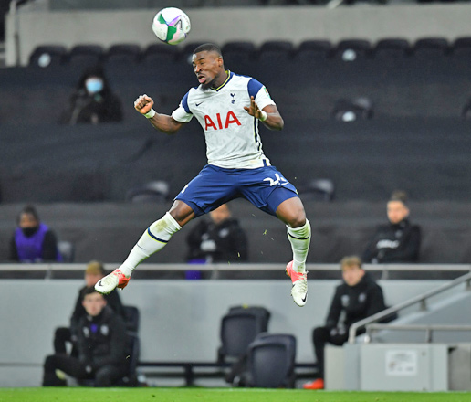 Tottenham Hotspur’s Ivorian defender Serge Aurier heads the ball against Brentford during their English League Cup semifinal first leg match in London on Tuesday  (AFP photo by Glyn Kirk)