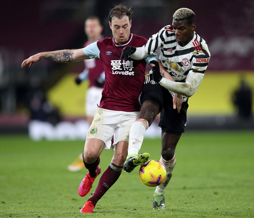 Burnley’s English striker Ashley Barnes (left) vies with Manchester United’s French midfielder Paul Pogba during their English Premier League match in Burnley on Tuesday  (AFP photo by Clive Brunskill)