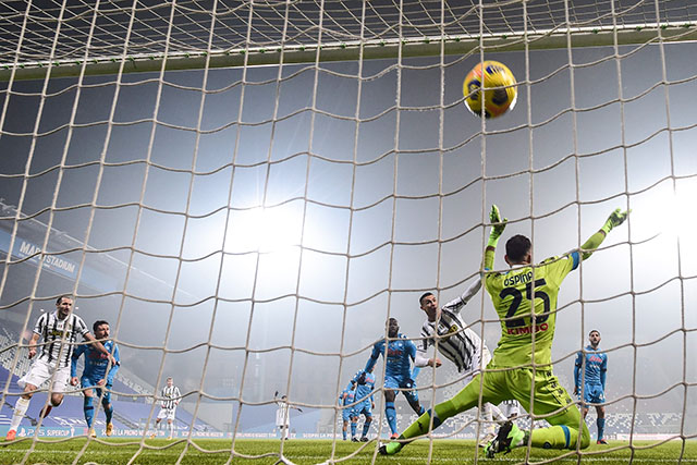 Juventus' Portuguese forward Cristiano Ronaldo (3rd right) shoots to score and open the scoring past Napoli's Colombian goalkeeper David Ospina during the Italian Super Cup match in Reggio Emilia on Wednesday (AFP photo by Miguel Medina)