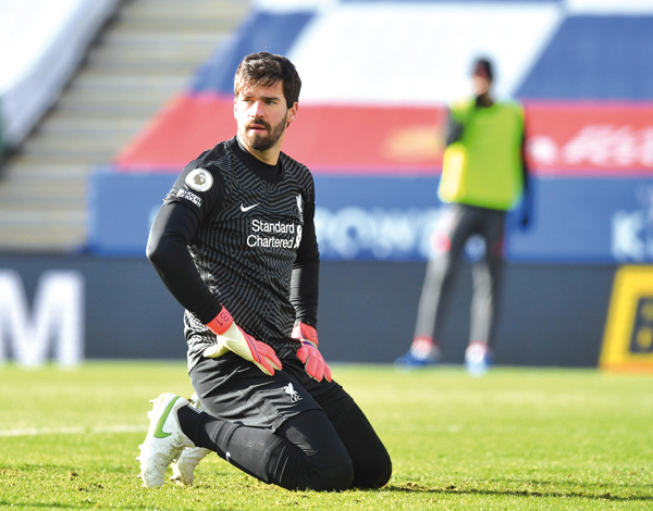Liverpool’s Brazilian goalkeeper Alisson Becker reacts against Leicester City during their English Premier League match in Leicester, England, on Saturday  (AFP photo by Paul Ellis)