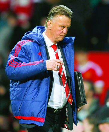 Manchester United’s Dutch manager Louis van Gaal leaves the pitch after winning the English Premier League football match against Crystal Palace in Manchester on Wednesday (Reuters photo by  Jason Cairnduff)