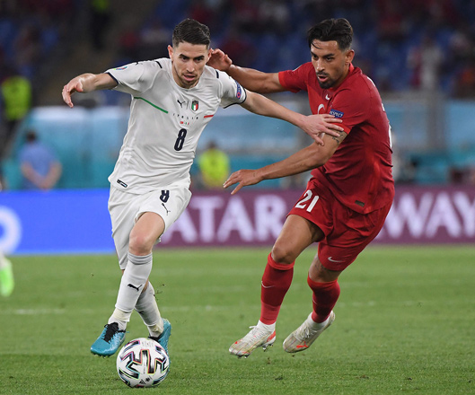 Italy’s midfielder Jorginho (left) and Turkey’s midfielder Irfan Can Kahveci vie for the ball during their UEFA EURO 2020 Group A match in Rome on Friday  (AFP photo by Alberto Lingria)