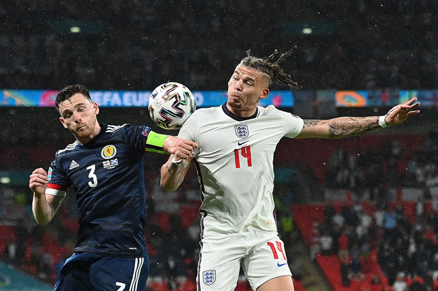 Scotland’s defender Andrew Robertson (left) and England’s midfielder Kalvin Phillips vie for the ball during their UEFA Euro 2020 Group D match in London on Friday (AFP photo by Justin Tallis)