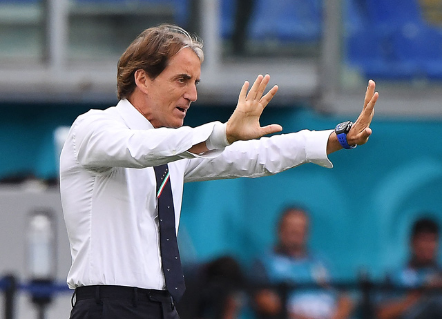 Italy’s coach Roberto Mancini speaks to his players during the UEFA Euro 2020 Group A match against Wales in Rome on Sunday  (AFP photo by Alberto Lingria)