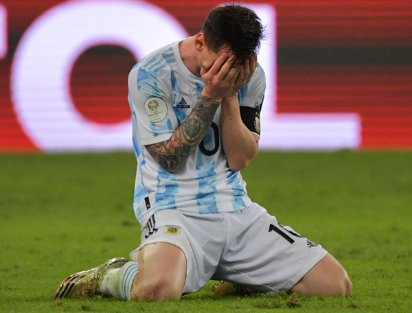 Argentina’s Lionel Messi reacts in celebration after winning the Conmebol 2021 Copa America tournament final match against Brazil in Rio de Janeiro, Brazil, on Saturday  (AFP photo by Nelson Almeida)