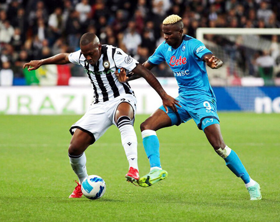 Udinese’s Brazilian footballer Samir (left) and Napoli’s Victor Osimhen vie for the ball during their Serie A match in Naples, Italy, on Monday (AFP photo)