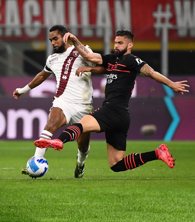 Torino’s Ivorian defender Koffi Djidji (left) fights for the ball with AC Milan’s French forward Olivier Giroud during their Italian Serie A match in Milan on Tuesday (AFP photo by Marco Bertorello)