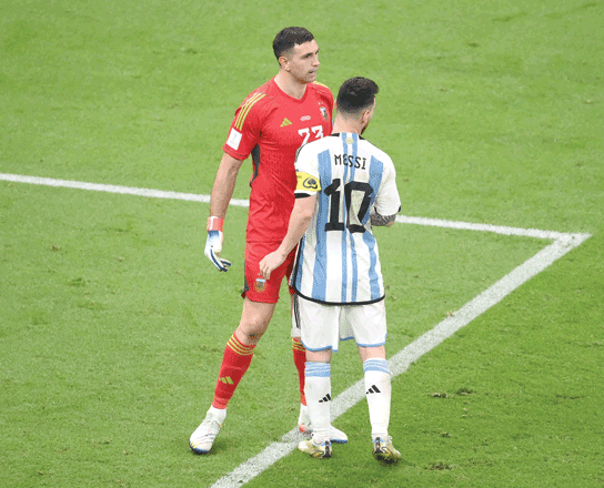 Argentina’s forward Lionel Messi speaks with goalkeeper Emiliano Martinez during their penalty shoot-out against the Netherlands in the Qatar 2022 World Cup quarter-final match in Lusail Stadium on Friday (AFP photo by Franck Fife)
