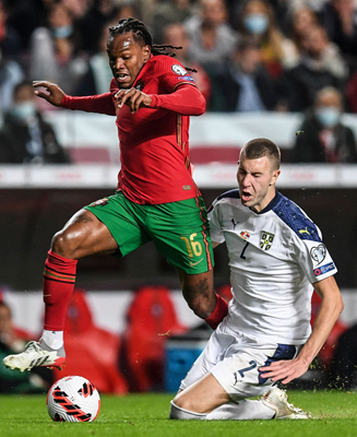Portugal’s Renato Sanches (left) fights for the ball with Serbia’s Strahinja Pavlovic during their FIFA World Cup Qatar 2022 qualification Group A match in Lisbon on Sunday (AFP photo by Patricia de Melo Moreira)