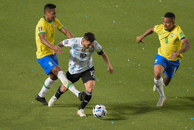 Argentina’s Lionel Messi (centre) is marked by Brazil’s Alex Sandro (left) and Gabriel Jesus during their South American qualification match for the FIFA World Cup Qatar 2022 in San Juan, Argentina, on Tuesday (AFP photo by Andres Larrovere)