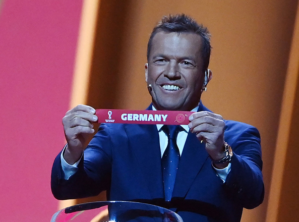 Former German footballer Lothar Matthaus displays the name of Germany during the draw for the 2022 World Cup in Doha, Qatar, on Friday  (AFP photo by Franck Fife)