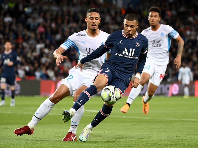 Paris Saint-Germain’s French forward Kylian Mbappe (right) controls the ball next to Marseille’s French defender William Saliba during their French L1 match in Paris on Sunday  (AFP photo by Franck Fife)
