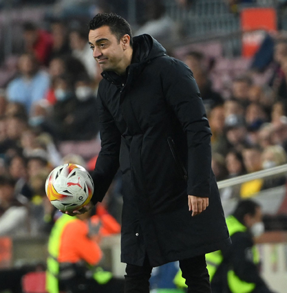 Barcelona’s Spanish coach Xavi holds a ball during their Spanish League match against Cadiz in Barcelona on Monday (AFP photo by Lluis Gene)