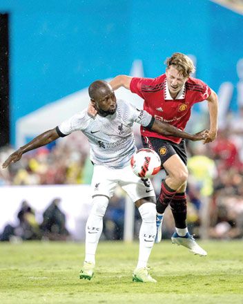 Liverpool’s Guinean midfielder Naby Keita (left) and Manchester United’s Charlie Savage fight for the ball during their exhibition match in Bangkok on Tuesday (AFP photo by Jack Taylor)