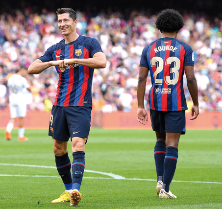 Barcelona’s Polish forward Robert Lewandowski celebrates scores against Elche during their Spanish League match in Barcelona on Saturday (AFP photo by Josep Lago)
