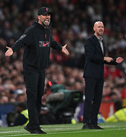 Liverpool’s German manager Jurgen Klopp (left) and Manchester United’s Dutch manager Erik ten Hag (right) gesture on the touchline during their English Premier League match in Manchester on Monday  (AFP photo by Paul Ellis)