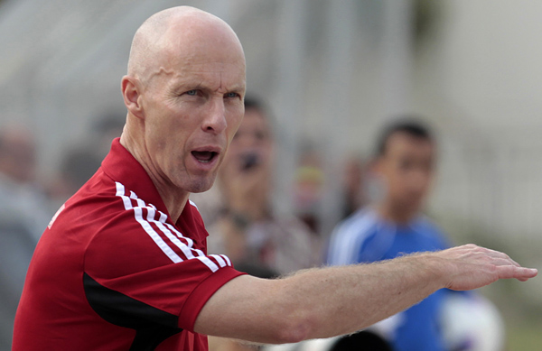 In this May 11, 2012 photo, Egypt’s coach Bob Bradley from the US gestures during a friendly football match between the Lebanese and Egyptian national teams in the northern port city of Tripoli, Lebanon (AP photo by Hussein Malla)