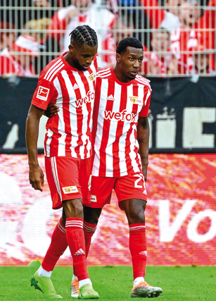 Union Berlin’s Jordan Siebatcheu (left) celebrates scoring against Wolfsburg with his teammate Sheraldo Becker during their German first division Bundesliga match on Sunday (AFP photo by John Macdougall)