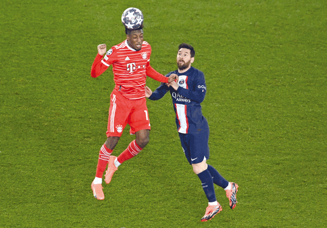 Bayern Munich’s forward Kingsley Coman (left) fights for the ball with Paris Saint-Germain’s forward Lionel Messi during their UEFA Champions League match in Paris on Tuesday (AFP photo by Alain Jocard)