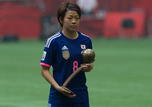Japan’s Aya Miyama holds her Bronze Ball award after the FIFA Women’s World Cup championship in Vancouver on Sunday (AP photo by Jonathan Hayward)