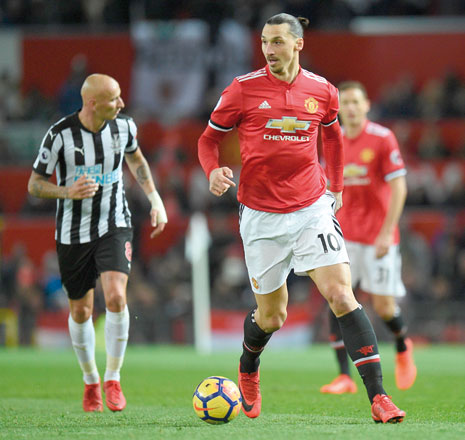 Manchester United’s Swedish striker Zlatan Ibrahimovic runs with the ball during the English Premier League football match against Newcastle in Manchester, England, on Saturday (AFP photo by  Oli Scarff)