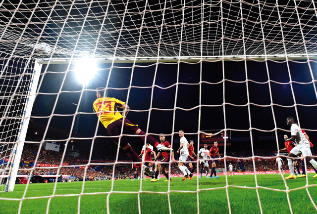 Switzerland’s defender Manuel Akanji (centre) scores against Spain’s goalkeeper Unai Simon during their UEFA Nations League match in Zaragoza on Saturday  (AFP photo by Javier Soriano)
