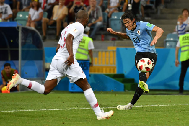 Uruguay’s forward Edinson Cavani (right) scores his team’s second goal during the 2018 World Cup round of 16 match against Portugal at the Fisht Stadium in Sochi on Saturday (AFP photo by Nelson Almeida)