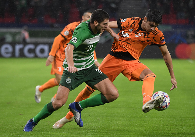 Ferencvaros' Georgian defender Lasha Dvali (left) and Juventus' Spanish forward Alvaro Morata vie for the ball during their UEFA Champions League Group G match in Budapest, Hungary, on Wednesday (AFP photo by Attila Kisbenedek)