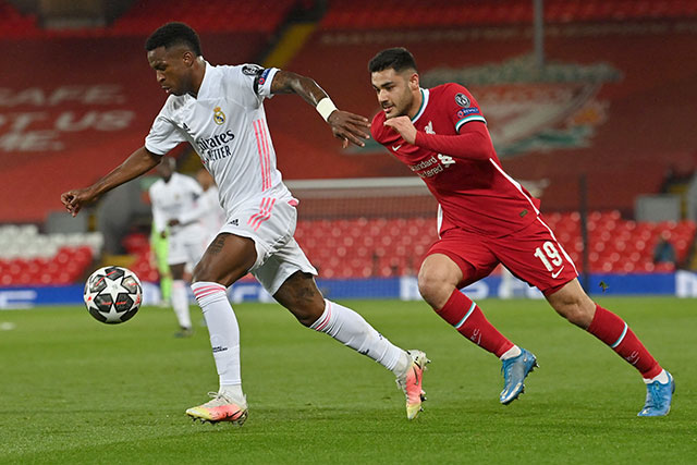 Real Madrid's Brazilian forward Vinicius Junior (left) vies with Liverpool's Turkish defender Ozan Kabak during their UEFA Champions League quarter-final second leg match in Liverpool, England, on Wednesday (AFP photo by Paul Ellis)