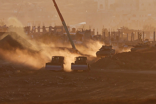 Israeli army vehicles are deployed at a position by Israel's border with the Gaza Strip, on May 6, 2025 (AFP photo) 