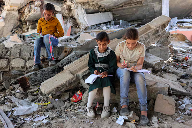 Children sit on rubble near a tent being used as a makeshift educational center in Jabalia, northern Gaza, on Sept. 8, 2024  (Credit: Omar al-Qattaa/AFP)