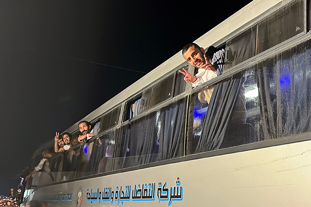 Palestinians, released by Israel, gesture as they arrive on a bus at the European Hospital in Khan Yunis in the southern Gaza Strip early on February 27, 2025 (AFP photo) 